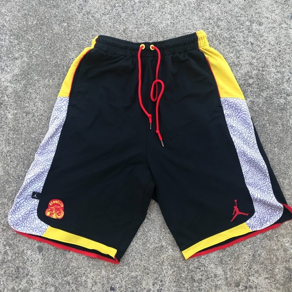 black and yellow jordan shorts